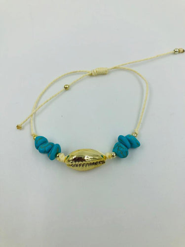 Armbandje goudkleurige schelp